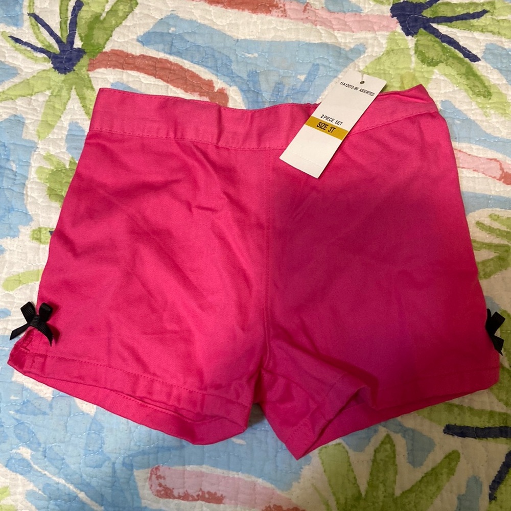 Pink shorts with black bow detail. Size 3T. NWT. Smoke free home.